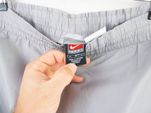 Load image into Gallery viewer, VINTAGE NIKE SOCCER TRACKPANTS - M