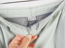 Load image into Gallery viewer, VINTAGE NIKE SWOOSH STRIPE TRACKPANTS - S