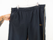 Load image into Gallery viewer, VINTAGE NIKE NYLON BAGGY TRACK PANTS - 34/36&#39;
